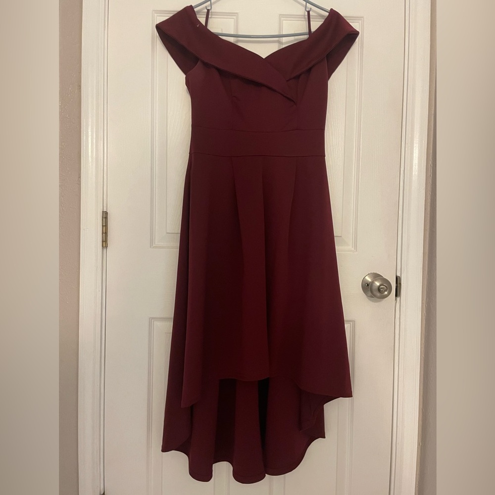 Burgundy dress, starts at knee ends at ankle, has pockets, off shoulder